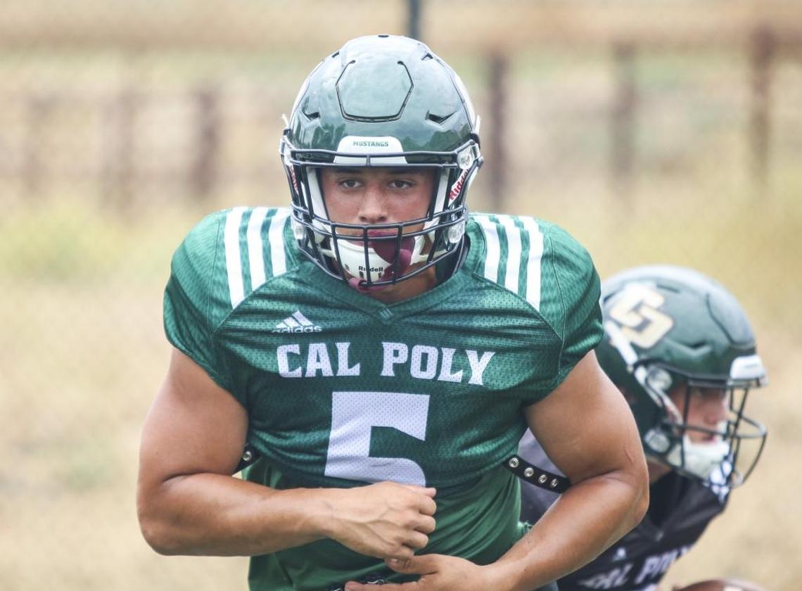 Cal Poly senior fullback Joe Protheroe runs through drills during fall camp.