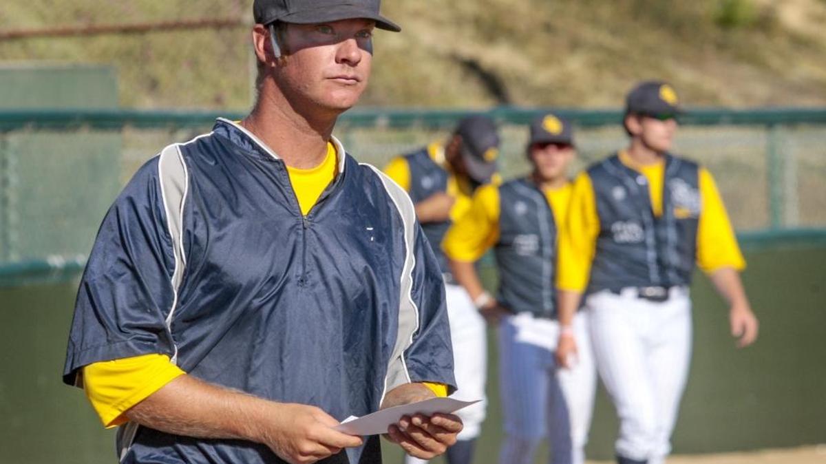 San Luis Obispo Blues head coach Clay Cederquist looks over the lineup before the start of a game Tuesday at Sinsheimer Stadium.