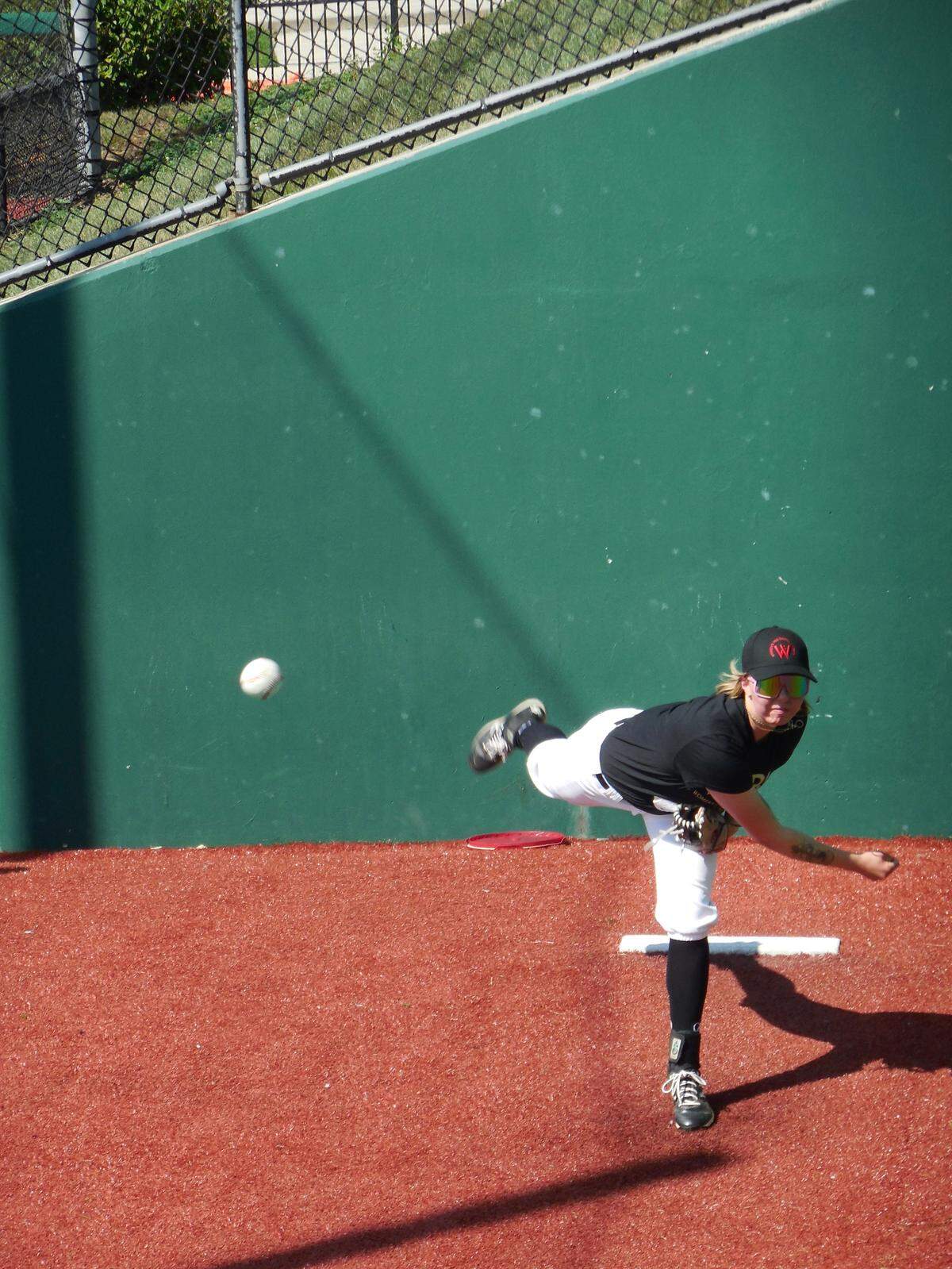 Cal Poly women’s club baseball player Arwen McCullough warms up to pitch in Washington, D.C., at the Women’s Professional Baseball League tryouts.