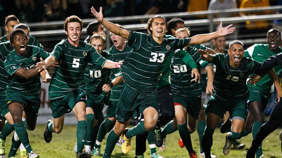 Cal Poly’s Kody Wakasa, center, celebrates his game winning goal in the second overtime against UCSB during a game Oct. 17 at Alex G. Spanos Stadium.