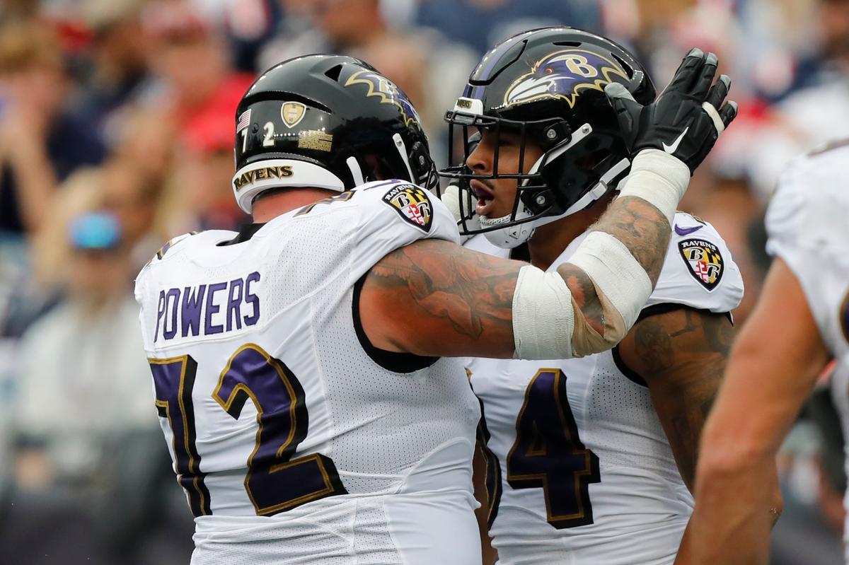 Baltimore Ravens tight end Josh Oliver, right, celebrates his touchdown with guard Ben Powers, left, in the second half of an NFL football game against the New England Patriots, Sunday, Sept. 25, 2022, in Foxborough, Mass. (AP Photo/Paul Connors)