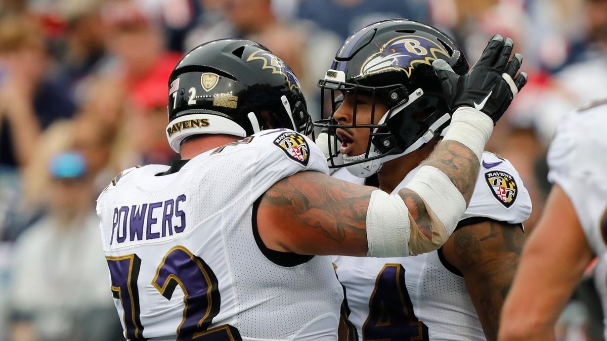 Baltimore Ravens tight end Josh Oliver, right, celebrates his touchdown with guard Ben Powers, left, in the second half of an NFL football game against the New England Patriots, Sunday, Sept. 25, 2022, in Foxborough, Mass.