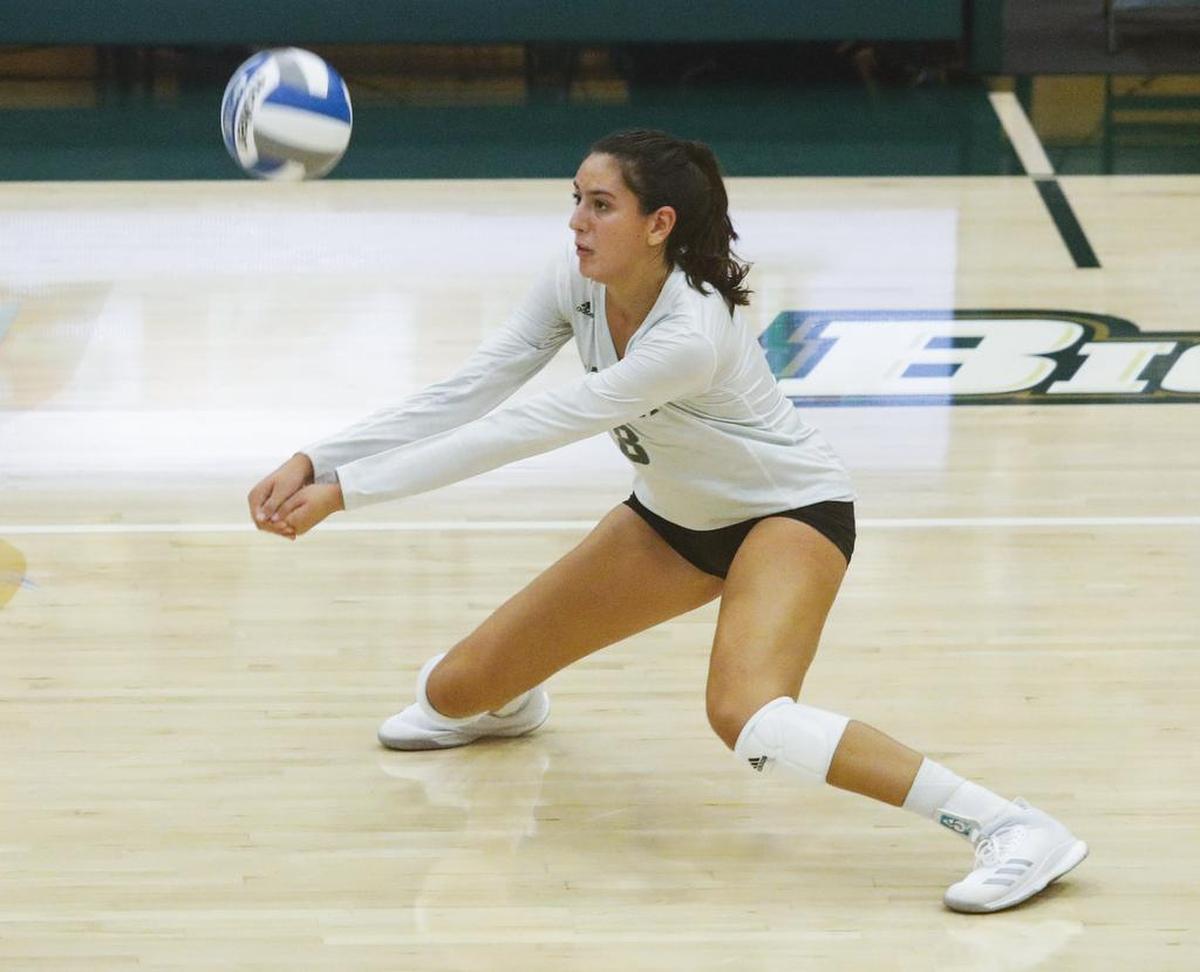 Cal Poly freshman Avalon DeNecochea returns a ball during a game against UCLA earlier this season at Mott Athletics Center in San Luis Obispo, California.
