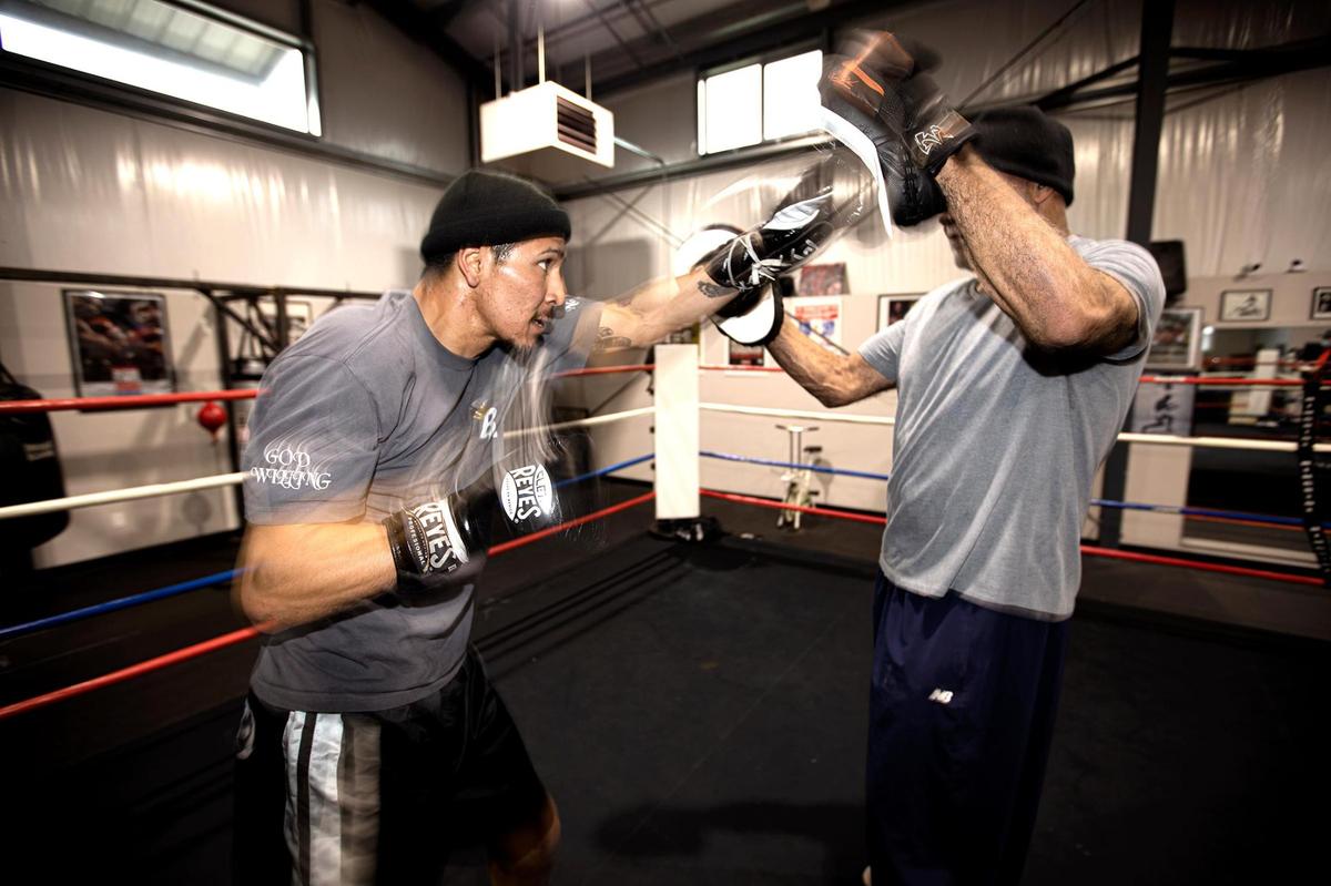 Boxer Bryan Martinez, a 24-year-old Paso Robles resident, spars with trainer Michael Dixon at Knockout Boxing Gym and Fitness in Paso Robles. Martinez is getting ready to fight his first pro match Sacramento on Jan. 21, 2022.