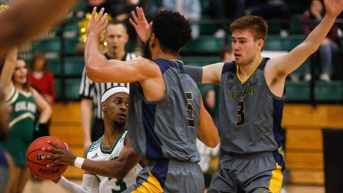 Senior Cal Poly guard Donovan Fields navigates traffic against UC Irvine in a Thursday loss at Mott Athletic Center.