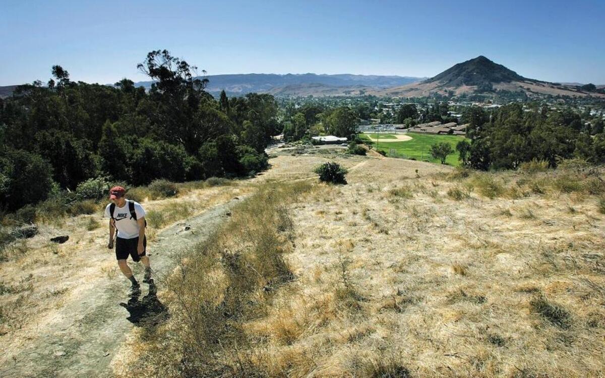 James Henderson takes an afternoon hike up the trail near Lizzie Street in San Luis Obispo. The survey ranked the percentage of people who exercise at least 30 minutes three days a week or more.