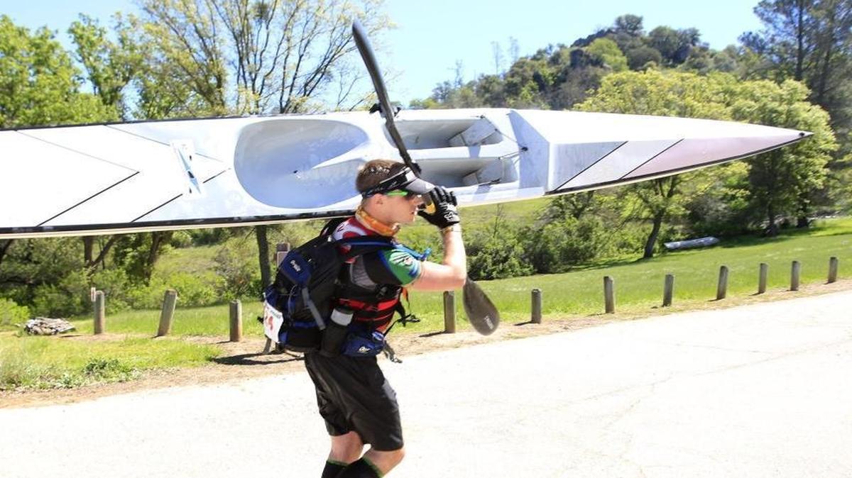 The 12th annual Checkpoint Challenge race was held Saturday morning at Santa Margarita Lake. Six-hour race winner Joe Harter comes out of the water and carriess his boat toward the finish line.
