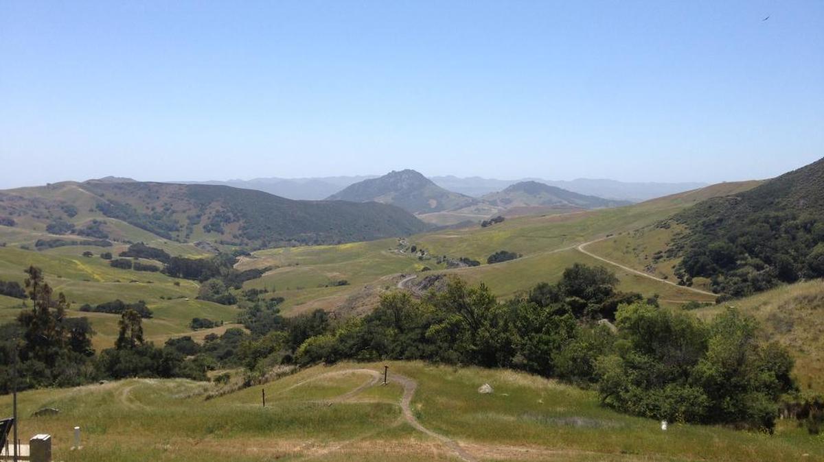 A view from the Stenner Creek trail. Cerro Romauldo, one of the Seven Sisters, can be seen in the distance.
