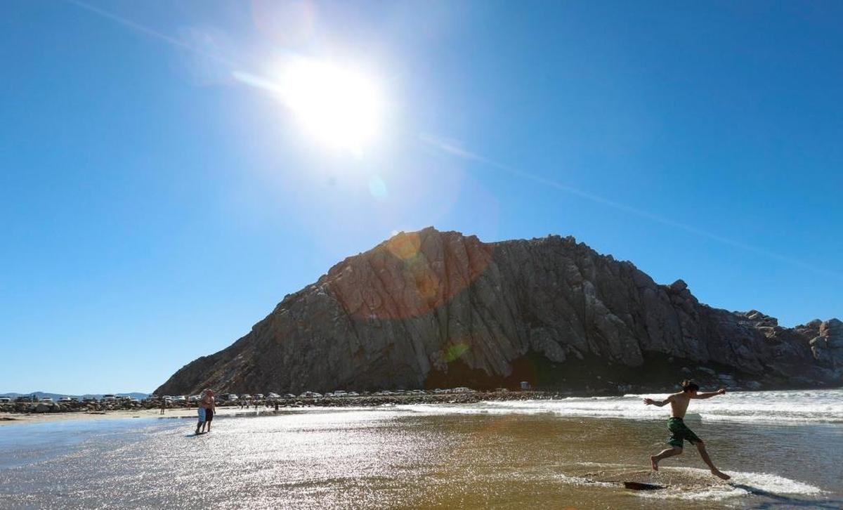 Brady Baker, 15, vacations with family skim boarding on Morro Rock Beach.
