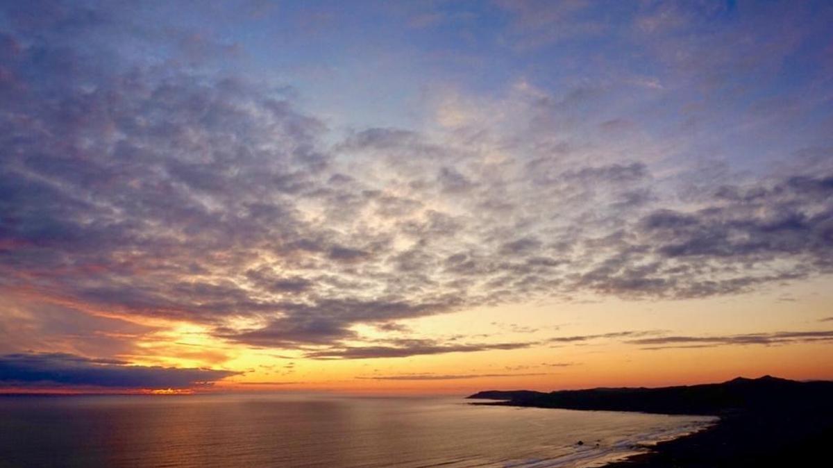 The view at sunset from the top of Hang Glider Hill in Cayucos, which offers sweeping views of the Pacific Ocean from Cayucos to Morro Bay.