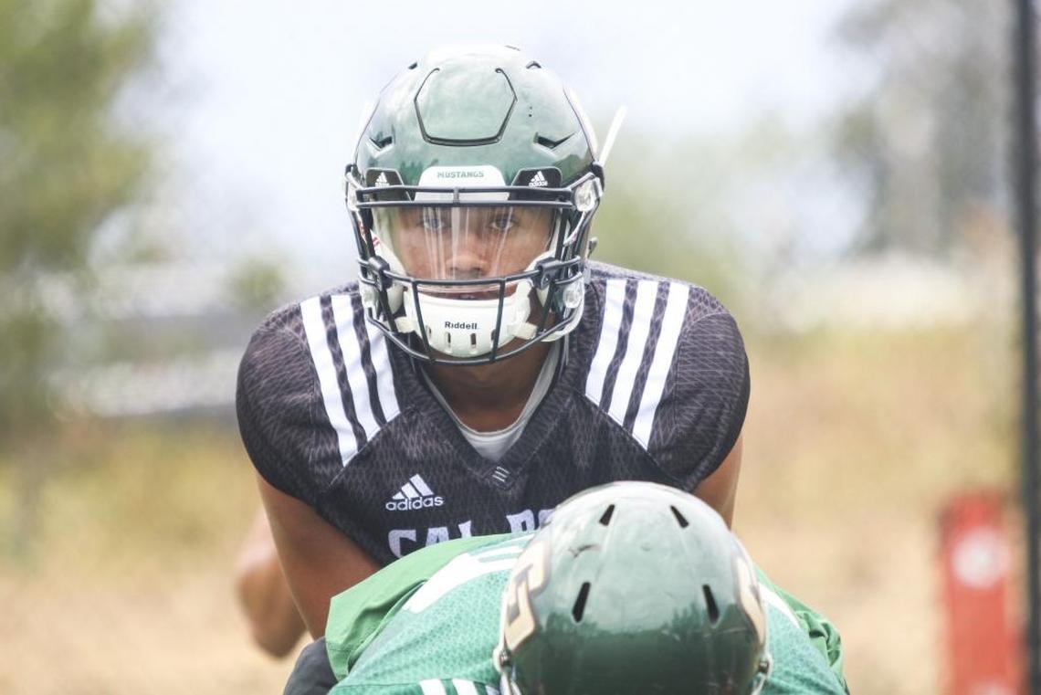 Cal Poly junior quarterback Khaleel Jenkins prepares to take a snap during fall camp.