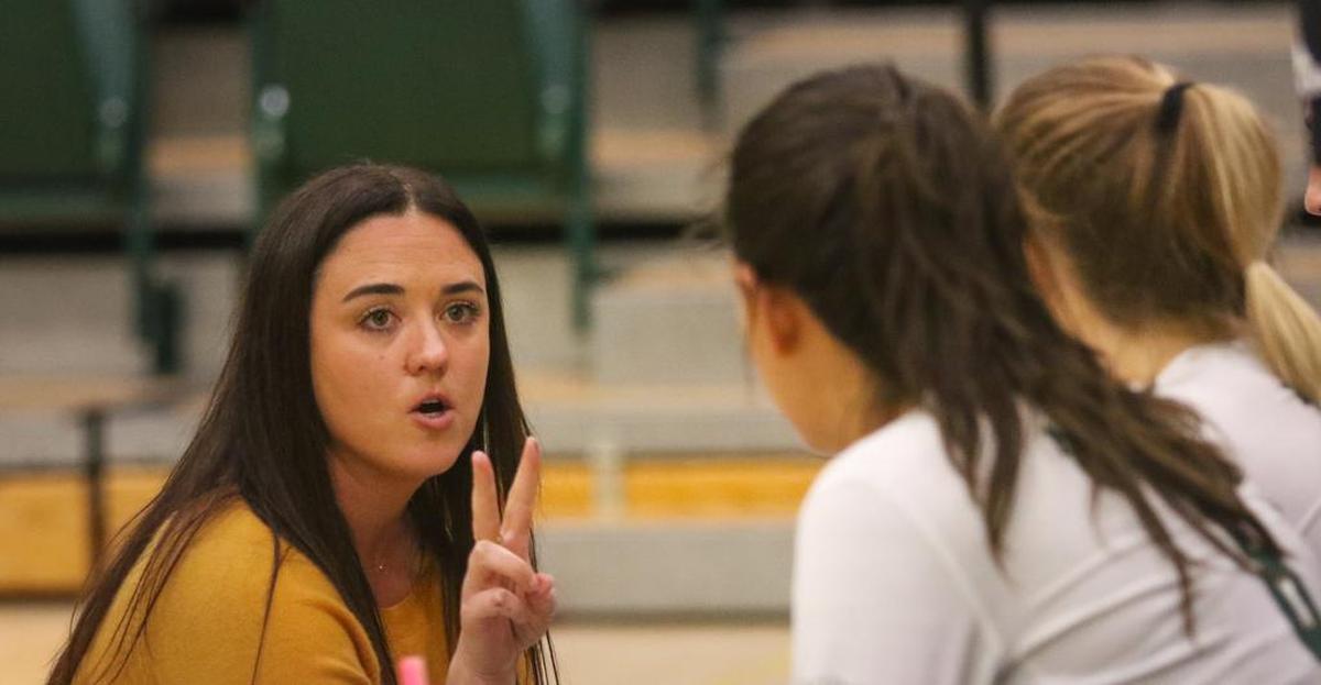 Head Coach Caroline Walters talks to team during timeout in an October match against CSUN.