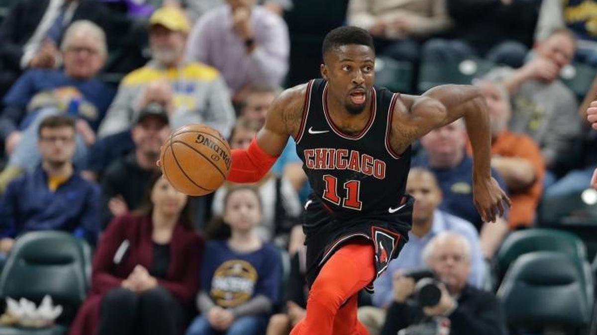 Chicago Bulls guard David Nwaba (11) heads up court in front of Indiana Pacers center Domantas Sabonis (11) during the first half of an NBA basketball game in Indianapolis, Wednesday, Dec. 6, 2017.