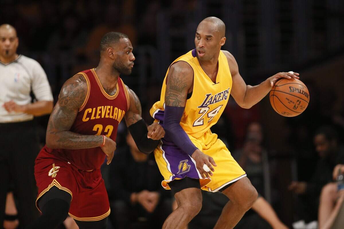 Cleveland Cavaliers’ LeBron James, left, defends Los Angeles Lakers’ Kobe Bryant, right, during the first half of an NBA basketball game, Thursday, March 10, 2016, in Los Angeles. Bryant died in a helicopter crash on Sunday, along with eight others.