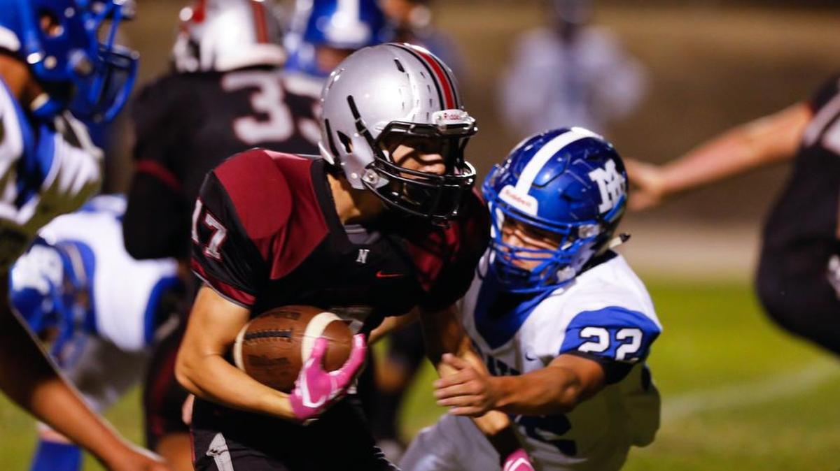 Nipomo High School Adrian Rabena carries the ball Friday night in an Ocean League football game against Morro Bay.